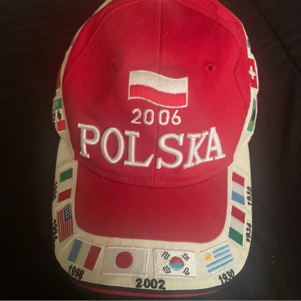 Polska 2006 hat from Hill adult size adjustable, has small flags around it. Red
